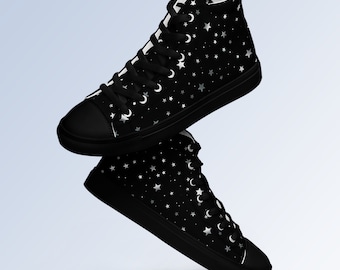 May include: Black high-top canvas sneakers with a silver star and crescent moon pattern.