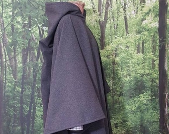 May include: A dark gray hooded cloak with a long, flowing design. The cloak is made of a soft, comfortable fabric and has a relaxed fit.