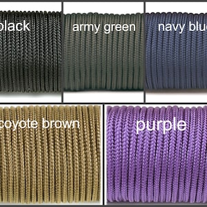 May include: Close-up of six spools of paracord in different colors: black, army green, navy blue, coyote brown, purple. The spools are arranged in two rows of three.