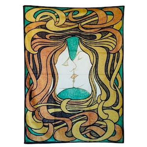 Full isolated view of The Kiss tapestry showing two intertwined faces framed by bold yellow, orange, green and black flowing forms.