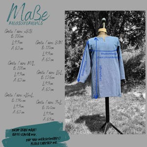 May include: A chart with measurements for different sizes of a tunic in centimeters. The chart includes bust circumference, length, and sleeve length. The tunic is light blue and is shown on a mannequin.