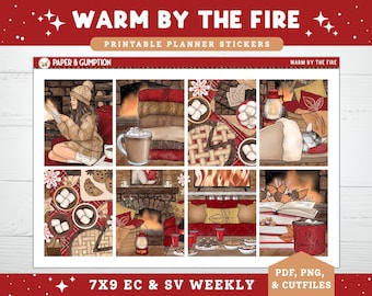 May include: Printable planner stickers with a cozy theme, featuring illustrations of a woman reading by a fireplace, hot cocoa, blankets, and a sleeping cat. The text "WARM BY THE FIRE" and "7X9 EC & SV WEEKLY" are visible.