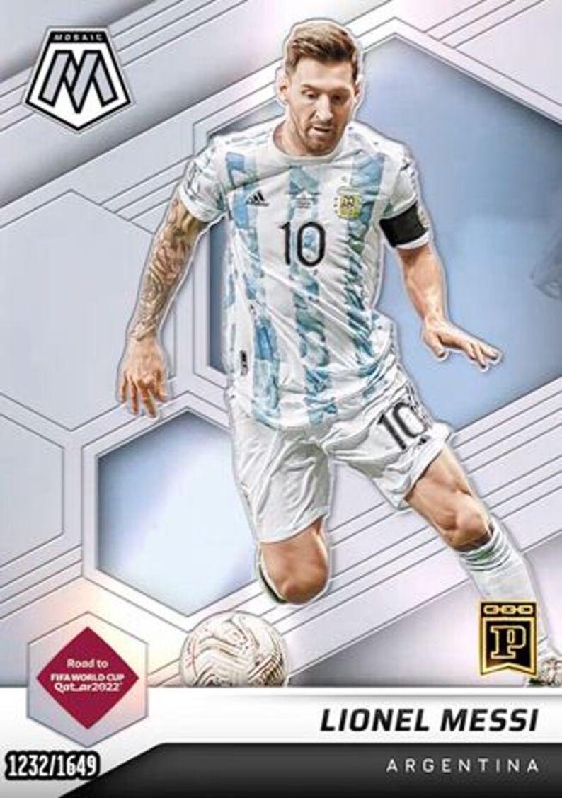 May include: A trading card featuring Lionel Messi in an Argentina soccer uniform. The card has a white and blue design with the number 10 on the jersey and shorts. The card includes the text "Road to FIFA World Cup Qatar2022".