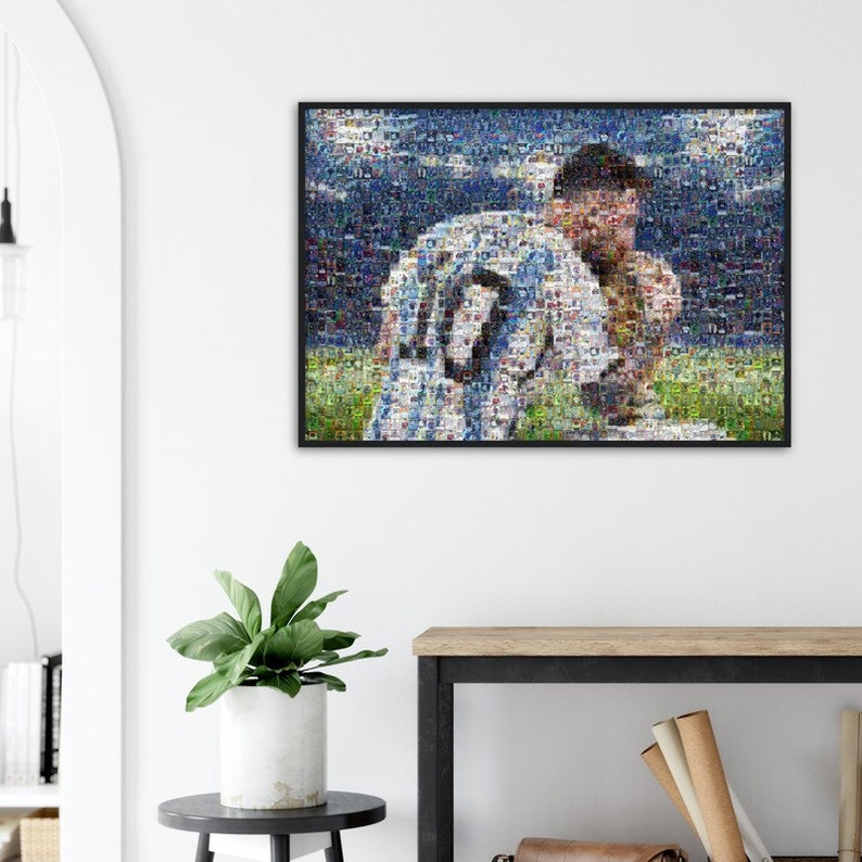 May include: Framed mosaic art print featuring a soccer player in a light blue and white jersey with the number 10. The artwork is composed of numerous small images, creating a detailed portrait. The background shows a green field and a blue sky.