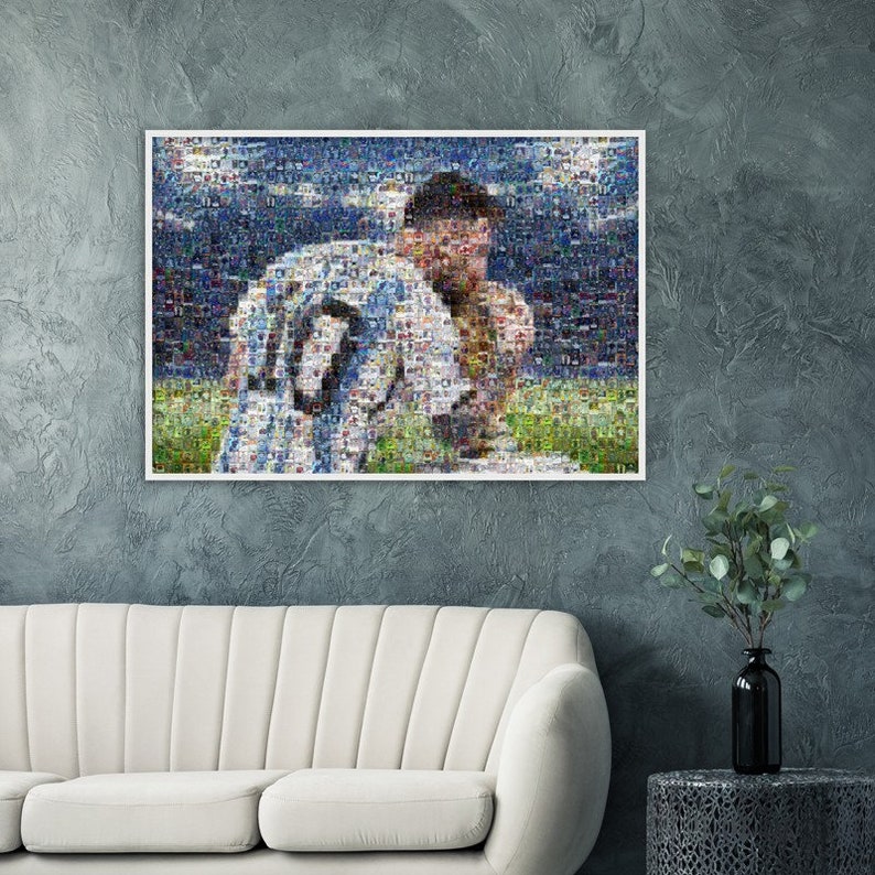 May include: A framed mosaic art print featuring a soccer player in a white and blue jersey with the number 10. The artwork is displayed on a gray wall above a white sofa. The mosaic is composed of many small images.