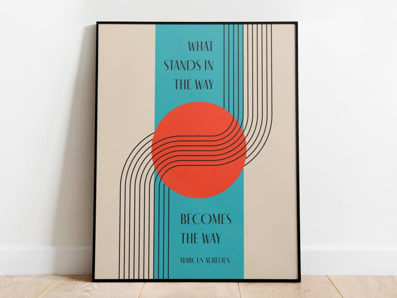 May include: A motivational quote poster with a teal background and a red circle with black lines. The quote reads "What stands in the way becomes the way" by Marcus Aurelius.