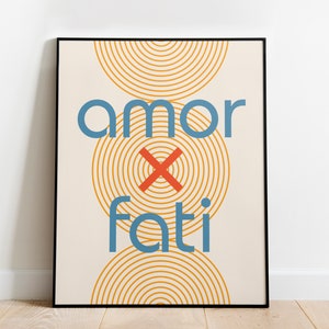 May include: A beige poster with a black frame features the text "amor x fati" in blue and red. The background is a pattern of concentric circles in orange.