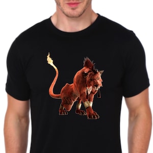 May include: Black t-shirt featuring a detailed illustration of a red lion-like creature with a fiery tail. The creature has a mohawk and is wearing gold armbands. The design is centered on the shirt.