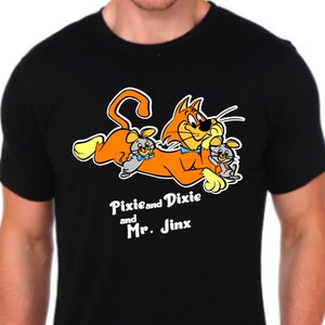 May include: Black t-shirt featuring an orange cat with a blue bow tie and two gray mice. The text "Pixie and Dixie and Mr. Jinx" is printed below the image.