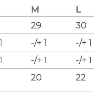 May include: Size chart for clothing with measurements in inches for body length, chest width, and tolerance for both measurements.
