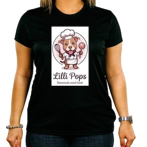 May include: A black t-shirt featuring a graphic of a brown dog wearing a white chef hat and apron. The dog holds a whisk and a lollipop. Below the graphic, the text reads Lilli Pops homemade sweet treats in a dark brown script and sans-serif font.