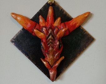 Orange Dragon Head ornament clay sculpture, acrylic painted on wood car or wall decoration