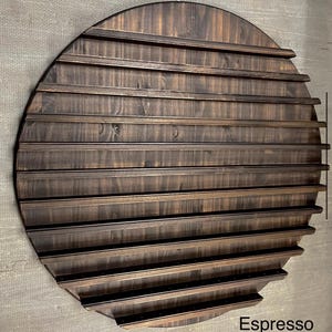 May include: A round, espresso-stained wooden display shelf with horizontal slats. The shelf is designed with a semi-circular shape and features multiple rows for displaying items. The word "Espresso" is printed at the bottom.