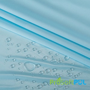 May include: A light blue fabric with water droplets on the surface. The fabric is smooth and has a slight sheen. The water droplets are round and clear. The text "ProSoftPUL" is visible in the lower right corner of the image.