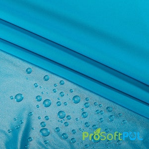 May include: A close-up of a turquoise fabric with water droplets on a textured surface. The fabric is water-resistant and has a ProSoftPUL logo.