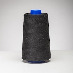May include: A spool of black thread with a blue plastic top.