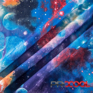 May include: A close-up of a blue, purple, and red fabric with a galaxy print. The fabric has a textured surface and is folded in a diagonal pattern. The text "PRXCOOL ATHLETIC PERFORMANCE FABRICS" is visible at the bottom of the image.