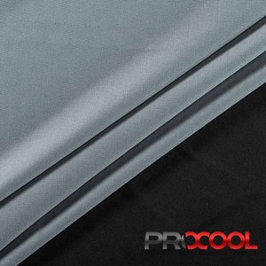 May include: Close-up of a light gray fabric with a subtle sheen. The fabric is folded in thirds, with the top layer folded over the bottom two layers. The fabric is smooth and soft, and it has a slightly textured surface. The fabric is on a black background with the word "PROCOOL" printed in red and white letters.