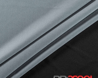May include: Close-up of a light gray fabric with a subtle sheen. The fabric is folded in thirds, with the top layer folded over the bottom two layers. The fabric is smooth and soft, and it has a slightly textured surface. The fabric is on a black background with the word "PROCOOL" printed in red and white letters.