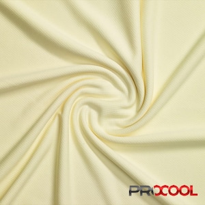May include: A close-up of a pale yellow fabric with a textured surface. The fabric is folded and draped, creating a soft, flowing effect.