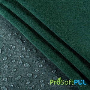 May include: Close-up of a dark green fabric with water droplets on the surface. The fabric is folded in half, and the droplets are beading up on the surface. The text "ProSoftPUL" is visible in the bottom right corner of the image.