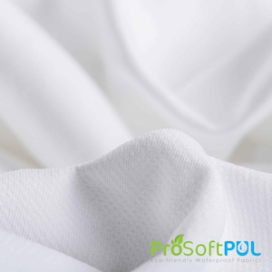 May include: Close-up of a white, textured fabric. The fabric is soft and smooth, with a subtle sheen. The fabric is labeled "ProSoftPUL Eco-friendly Waterproof Fabrics".