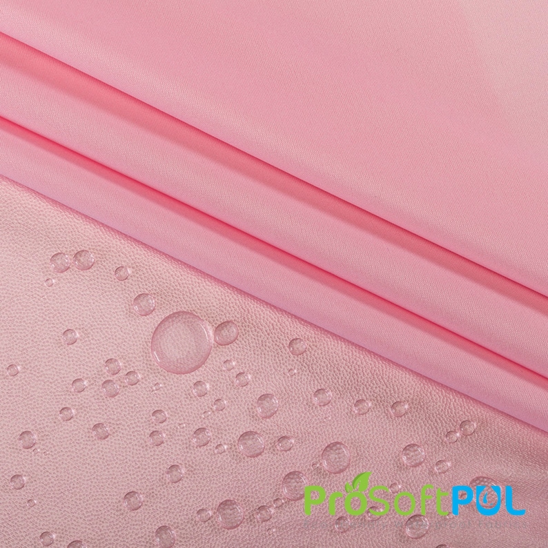 May include: Pink fabric with a water-resistant finish. Water droplets bead up on the surface of the fabric.