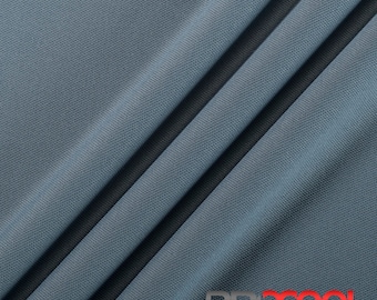 May include: A close-up of a blue athletic performance fabric with a textured surface. The fabric is folded in a way that shows the texture and drape. The text "PRXCOOL ATHLETIC PERFORMANCE FABRICS" is visible at the bottom of the image.