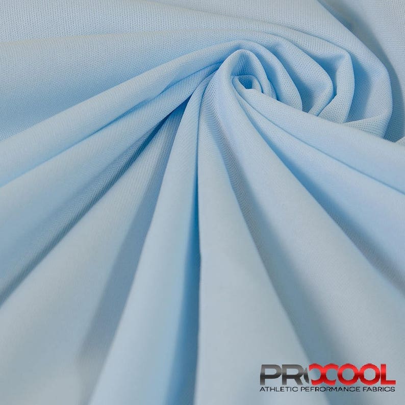 May include: A close-up of a light blue athletic performance fabric. The fabric is smooth and has a slight sheen. The fabric is made by ProCool, a company that specializes in athletic performance fabrics.