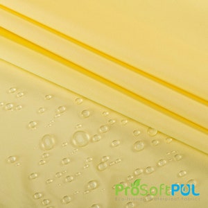 May include: Yellow fabric with water droplets on the surface. The fabric is smooth and has a slight sheen. The text "ProSoftPUL Eco-friendly Waterproof Fabrics" is visible in the lower right corner of the image.