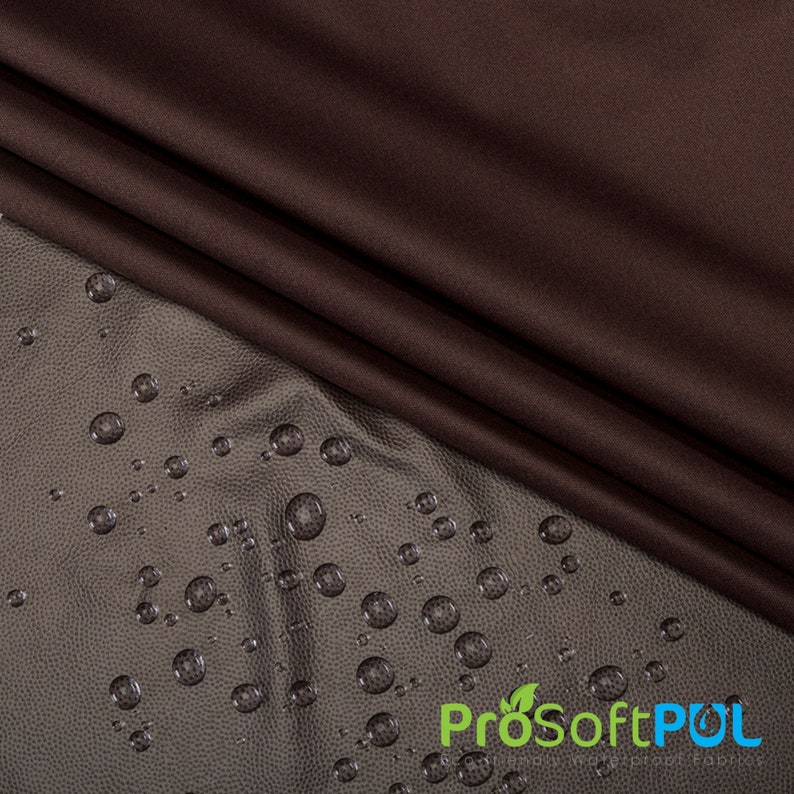 May include: A close-up of a brown fabric with water droplets on a textured surface. The fabric is water-resistant and has a soft feel. The text "ProSoftPUL" is visible in the lower right corner of the image.