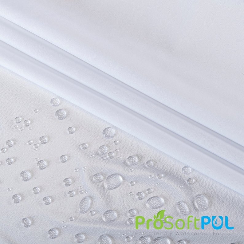May include: White waterproof fabric with water droplets on the surface. The fabric is smooth and has a slight sheen. The text "ProSoftPUL Eco-friendly Waterproof Fabrics" is visible in the lower right corner of the image.