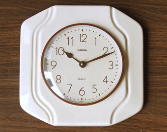 Off White Mid Century ceramic Wall Clock made by Europa, Germany