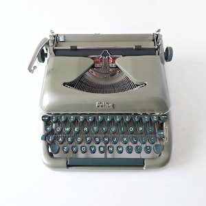 Máquina de escribir Erika modelo 10 en EXCELENTE estado. ¡Revisión profesional!