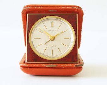 Brass Mid Century Travel Alarm clock, Red Leather case by Europa, 7 Jewels, Germany