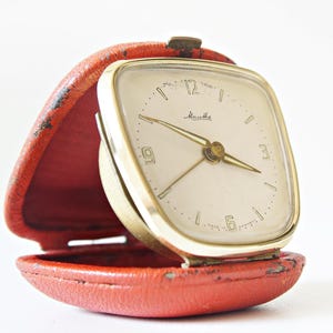 MAUTHE Mid Century Travel Alarm clock, Red leather case, made in Germany.