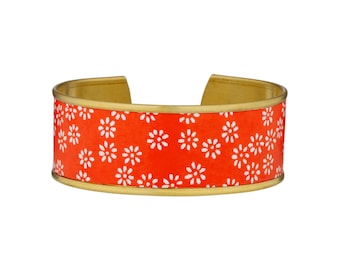 Brass cuff bracelet and red Japanese paper with white flowers