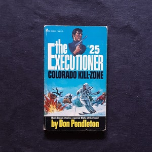 May include: The Executioner #25: Colorado Kill-Zone paperback book cover featuring a man holding a gun, a snowy mountain scene, and the text "Mack Bolan attacks a special Mafia strike force!" by Don Pendleton.