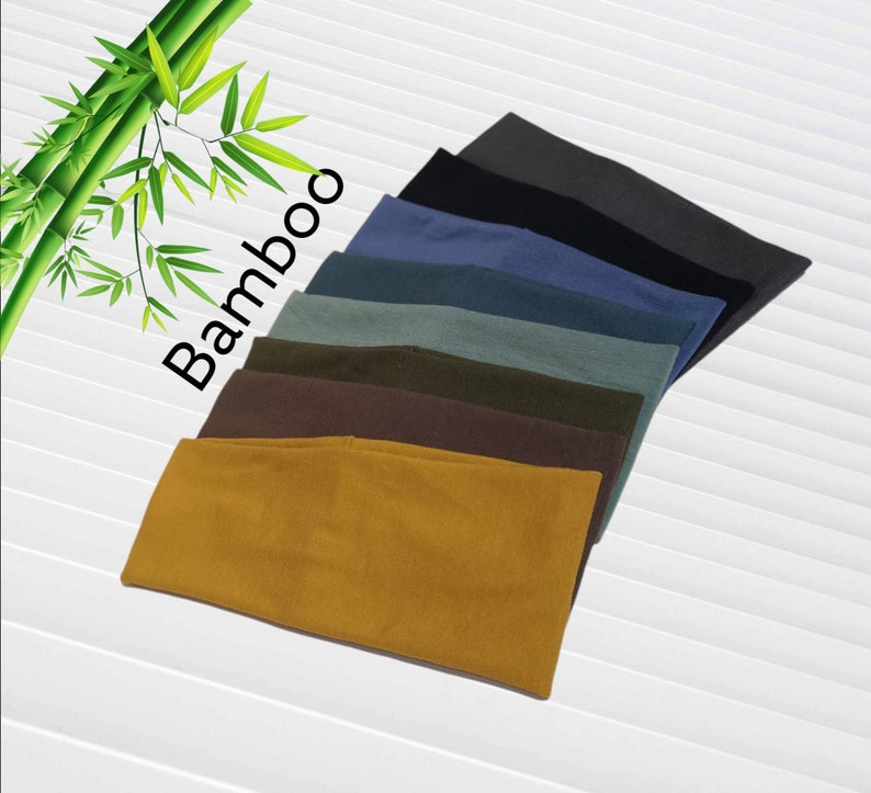 May include: A collection of bamboo headbands in various colors, including mustard yellow, brown, olive green, teal, navy blue, and charcoal gray. The word "Bamboo" is printed in black on the image.
