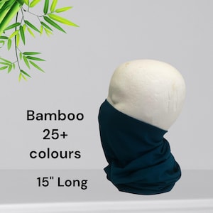 May include: A white ceramic mug with a black handle and the text "But First, Coffee" in a black, handwritten-style font. The mug is on a white surface.