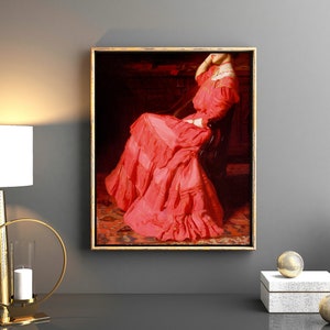 May include: A framed painting of a woman in a red dress sitting in a chair. The painting is set against a dark background and the woman's dress has many ruffles.