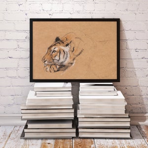 May include: A framed black and white pencil drawing of a tiger's head on a brown background. The tiger is looking to the left and has a serious expression. The drawing is on a stack of books.