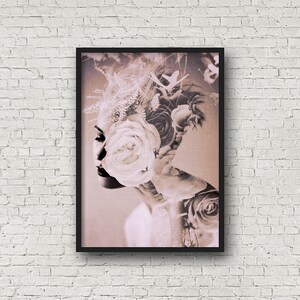 May include: A sepia toned photograph of a woman's face with flowers covering her head and face. The flowers are white and pink.