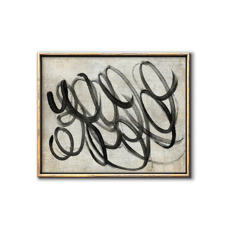 May include: Abstract painting with black brushstrokes on a light gray canvas, framed in a gold frame.