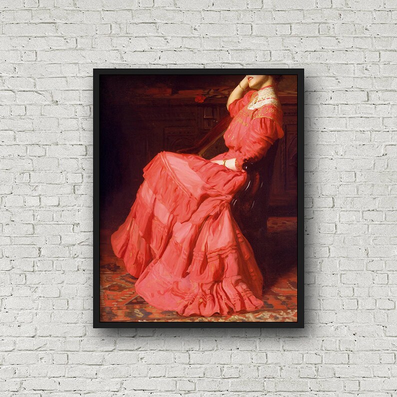 May include: A woman in a red dress sits in a chair with her arm resting on the back. The dress has a lot of ruffles and is very detailed. The background is dark and blurry.