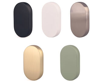 May include: Five oval-shaped door knobs in different finishes: black, white, silver, gold, and green.