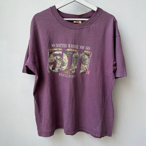 90s Levi’s Faded Mauve Tshirt with ‘501’ ‘No matter where you go we rule jeans’ graphic. Boxy fit. Made in Canada. Sz XL