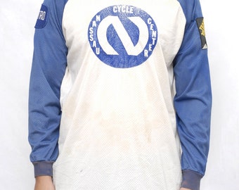 Nassau Cycle Center' LS Graphic Mesh T-shirt.
