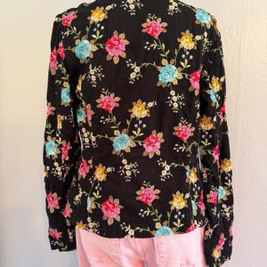 May include: A set of three ceramic mugs with a speckled, matte finish. The mugs are in shades of cream, light gray, and dark gray. Each mug has a simple, minimalist design and a rounded handle. The mugs are stacked on top of each other.