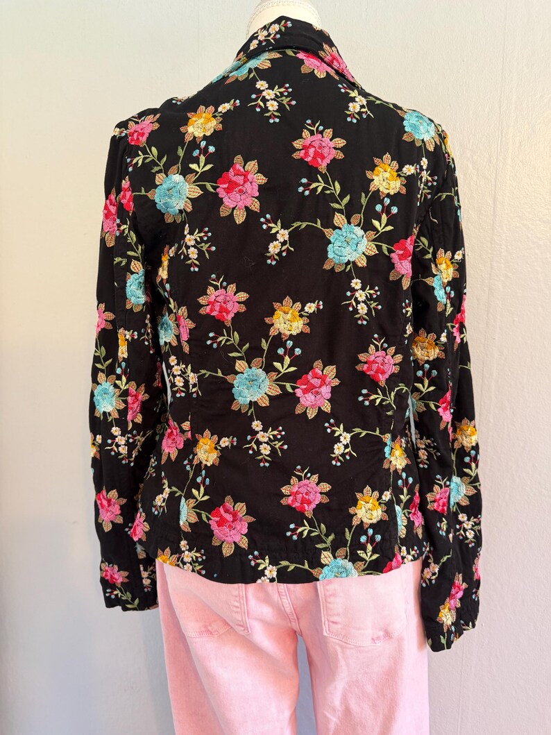 May include: A set of three ceramic mugs with a speckled, matte finish. The mugs are in shades of cream, light gray, and dark gray. Each mug has a simple, minimalist design and a rounded handle. The mugs are stacked on top of each other.